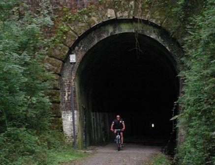 7 night Ride Devon Coast to Coast Cycle Route, leaving Plymouth riding through a tunnel